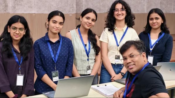 Judges reviewing submitted campus hackathon projects